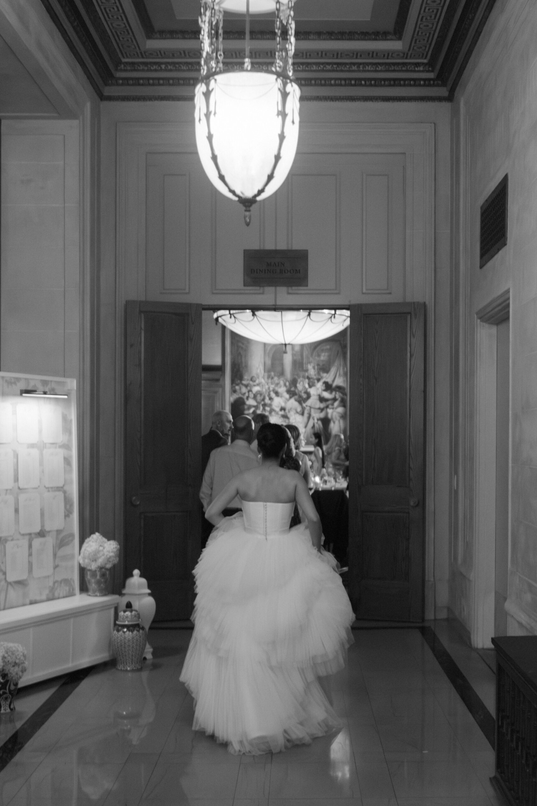 A bride walking into the ballroom at the Detroit Athletic Club